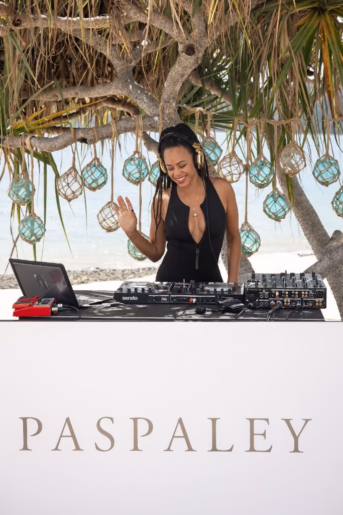 Miss Renee Simone DJing a Paspaley Pearls beach party, Hamilton Island. Photo by Lean Timms